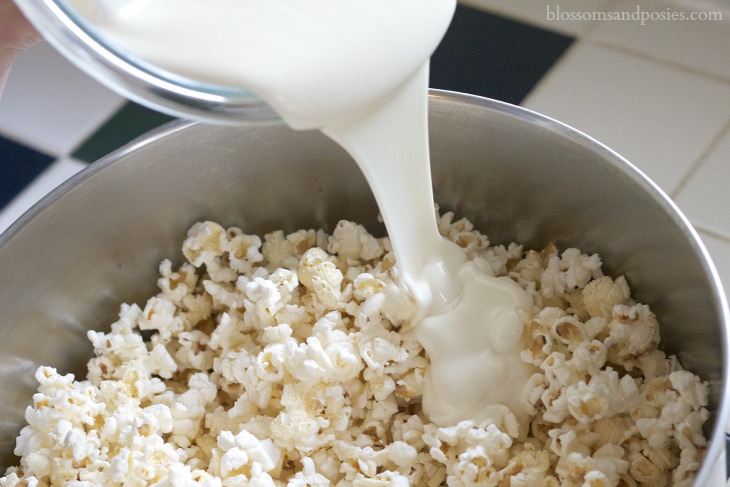 pour popcorn into pan - Blossoms and Posies