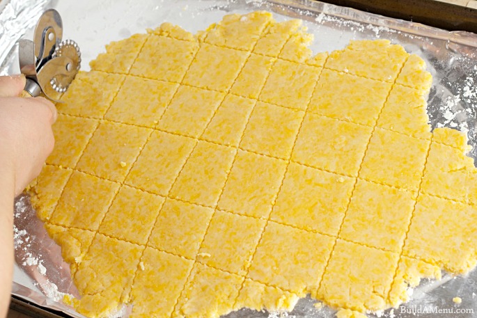 pastry wheel cutting cracker dough - BlossomsAndPosies.com