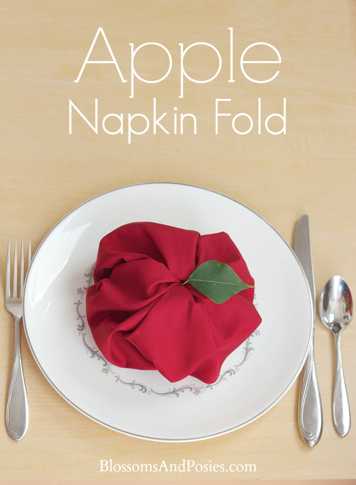 Add a whimsical touch to your next autumn party with this easy apple napkin fold! #teaparty #autumn #hospitality